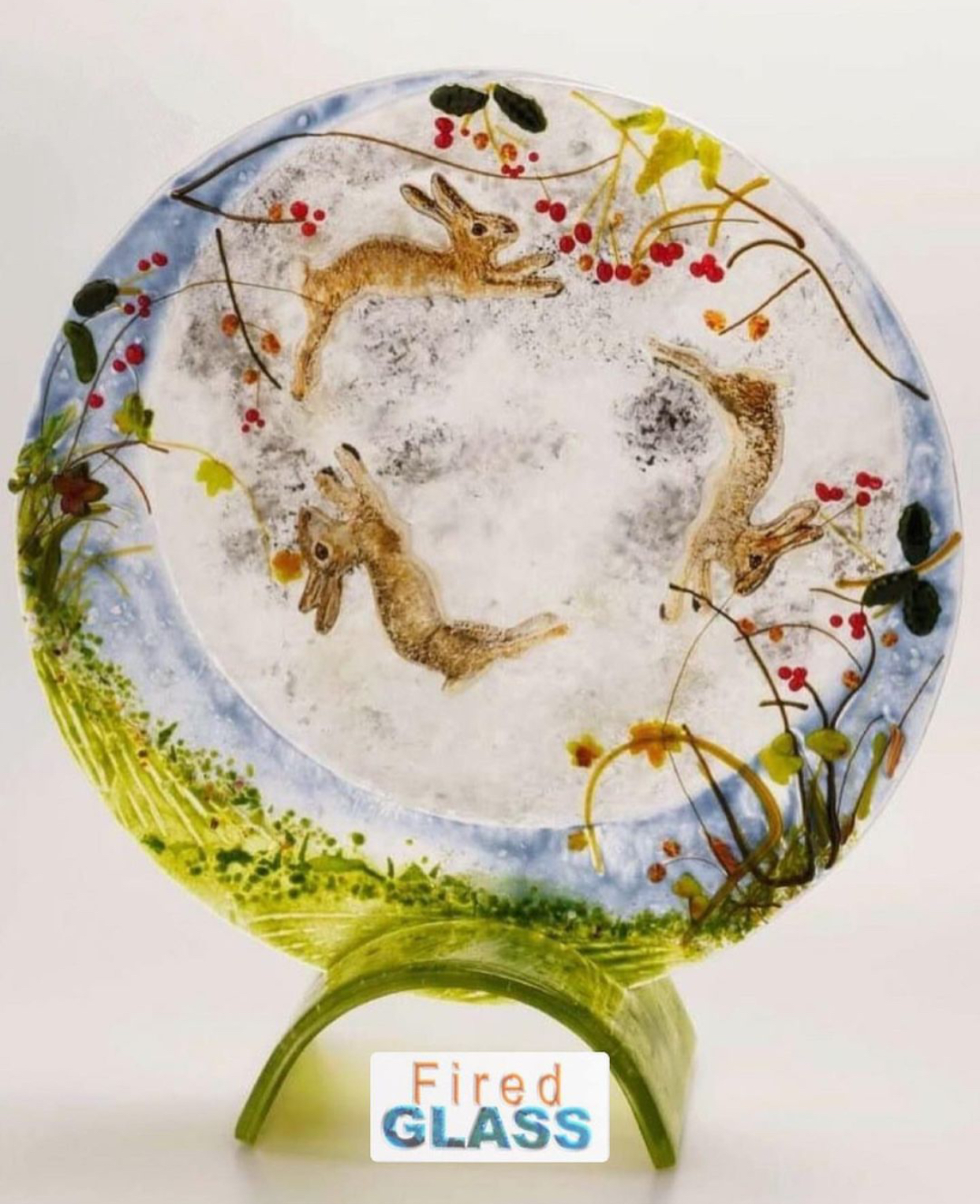 Hares in a circle in fused glass